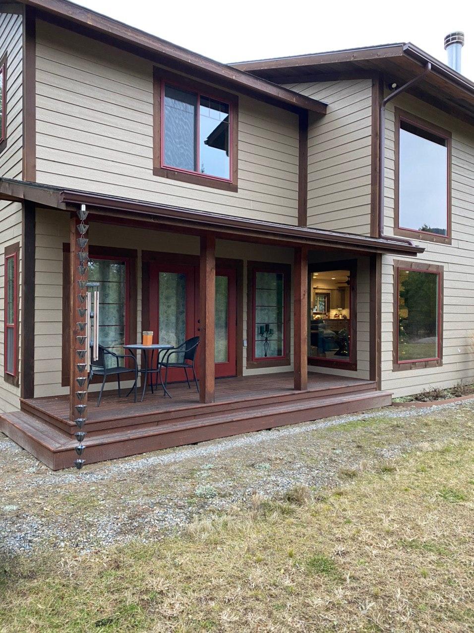 Rain chain installation on home exterior