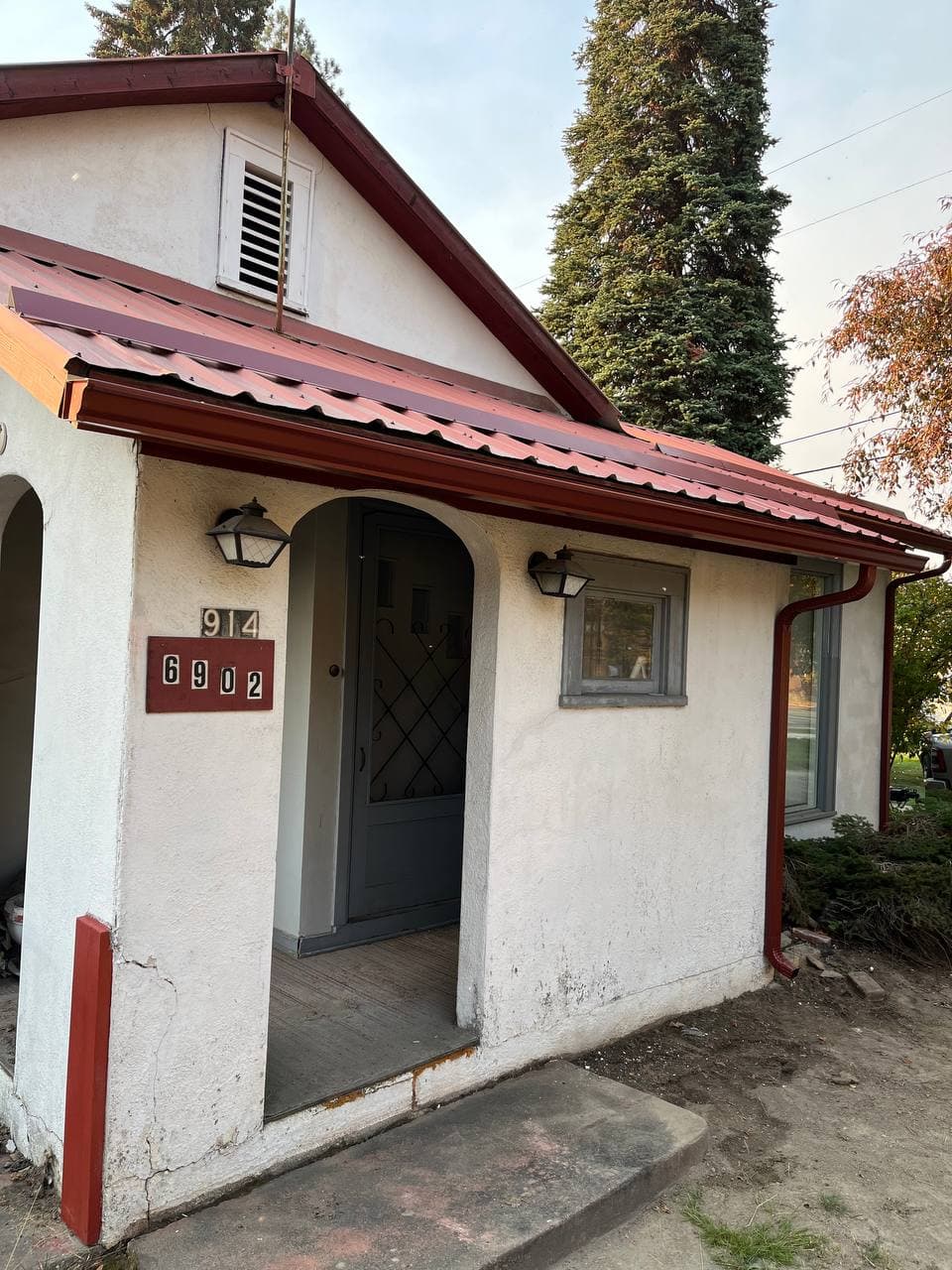 Gutter installation on home with front porch