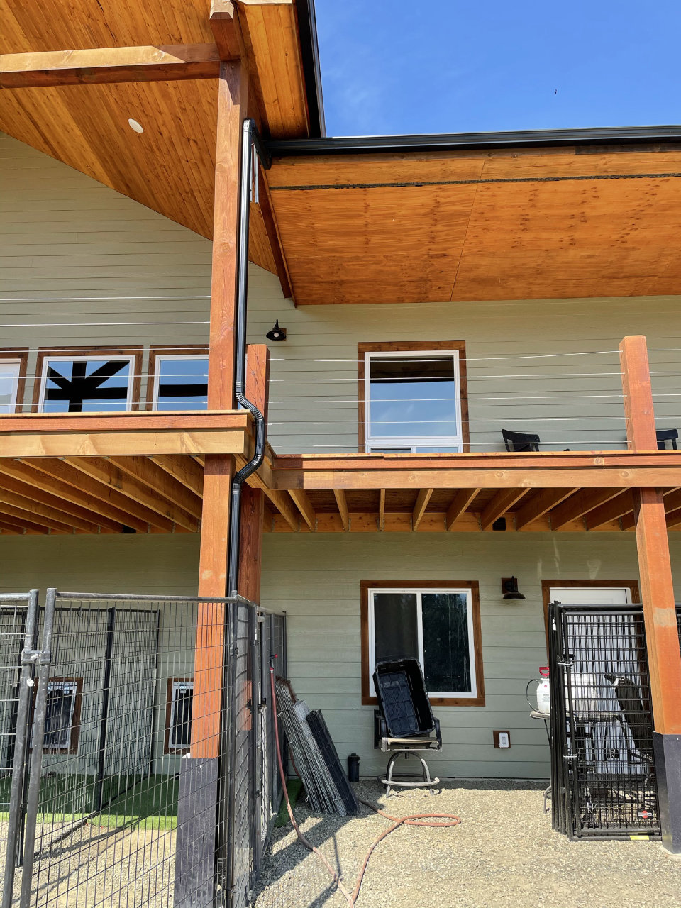 Seamless gutter installation on wood-sided home