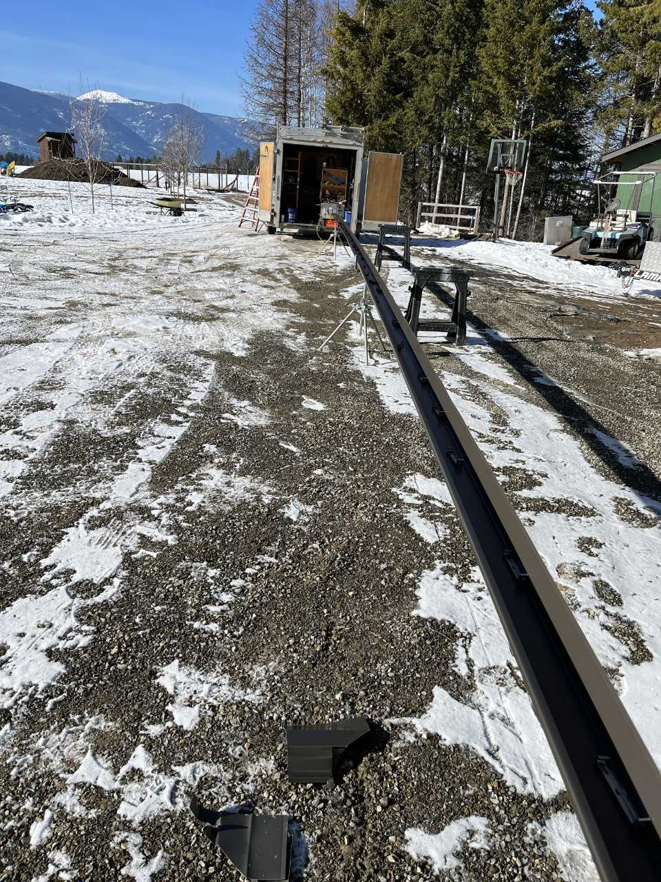 On-site seamless gutter fabrication setup