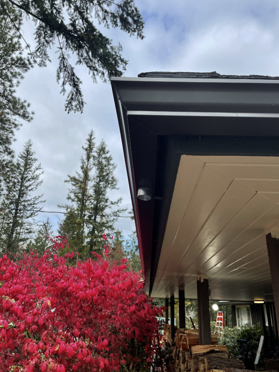 Gutter installation on dark-sided home
